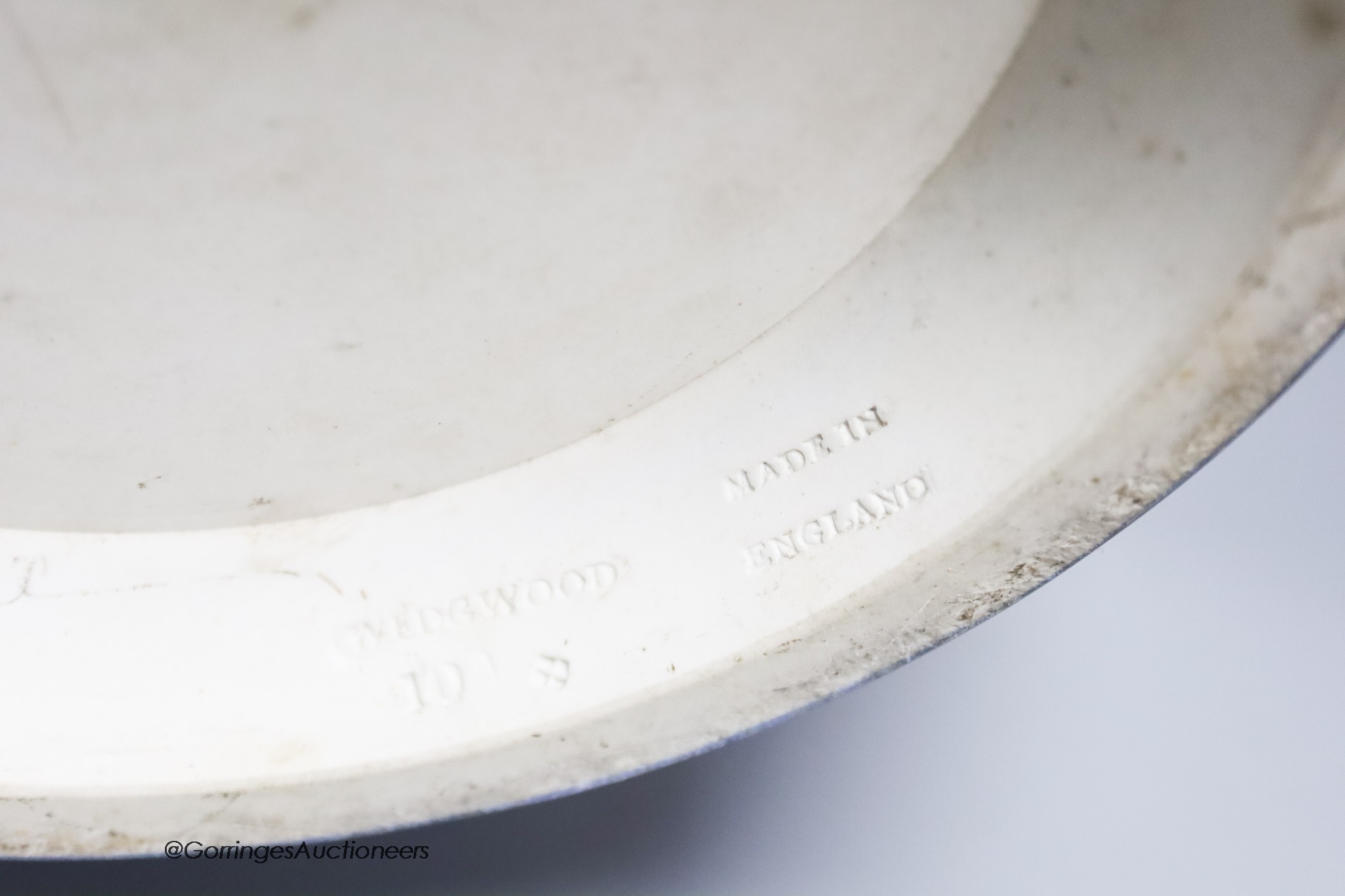 A Wedgwood blue jasper jardiniere, sprigged with muses and swags, height 23cm